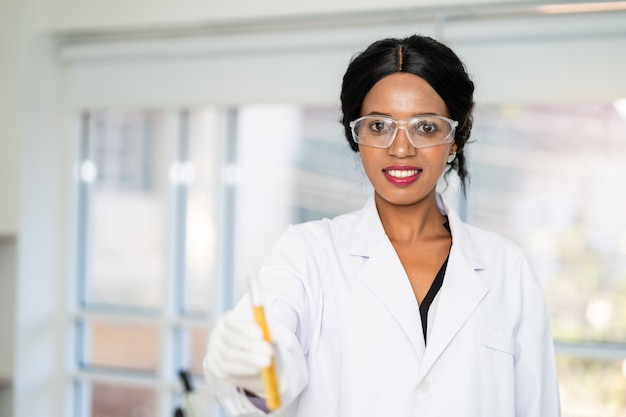 Scientist  in laboratory with holding a test tube. Medical healthcare technology and pharmaceutical research and development concept