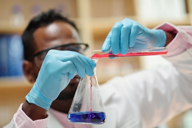 Scientist Mixing Liquids