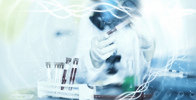 A scientist researcher in the laboratory is testing drugs for treatment of viral pneumonia. Coronovirus blood test of infected patients. World pandemic.