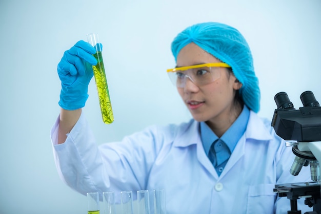 The scientist test the natural product extract, oil and biofuel solution, in the chemistry laboratory