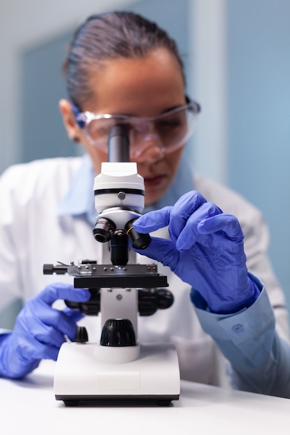 Scientist woman doctor analyzing coronavirus test results