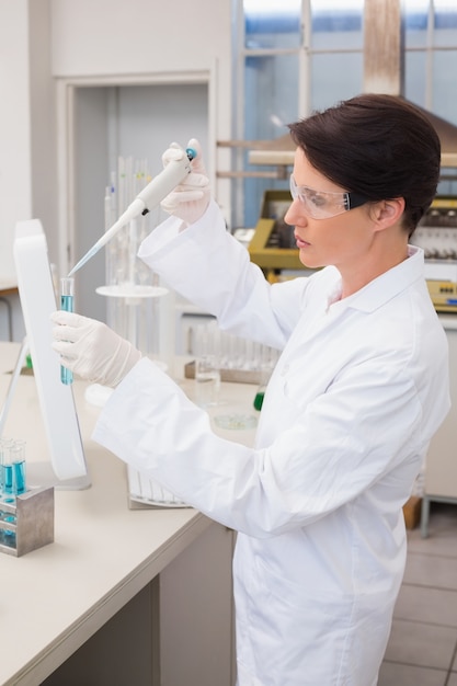 Scientist working attentively with test tube