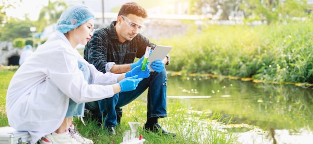 Scientists biologists analyze sample water at an industrial estate Environment issues