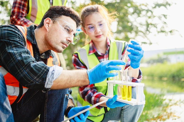 Scientists biologists research by sample water contaminated from industrial estate