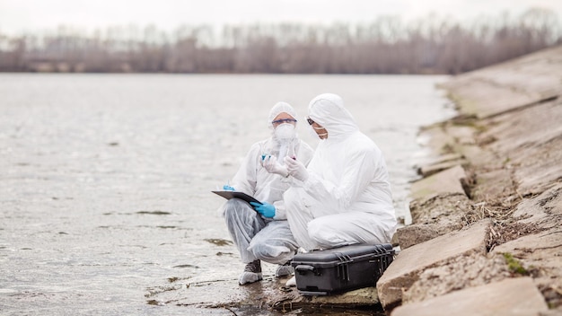 Scientists or biologists working together on water analysis