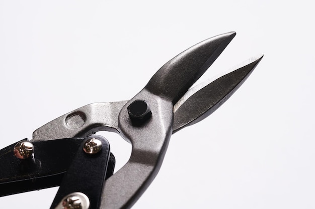 Scissors for cutting metal closeup isolated on white background