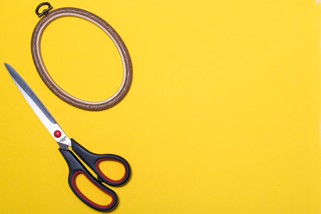 Scissors for cutting and sewing on a colored background