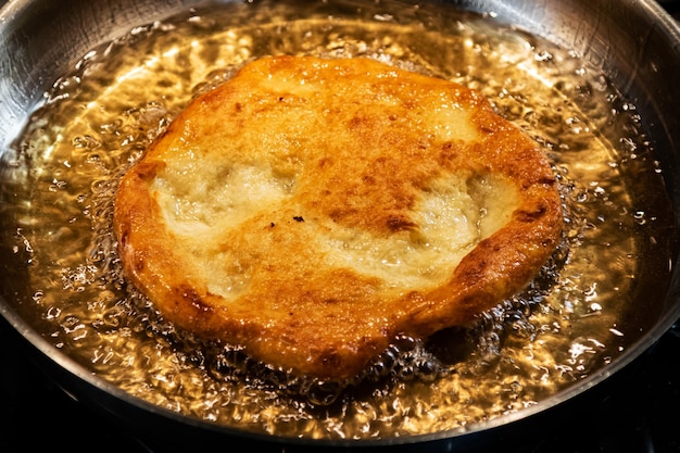 Scone baking in many cooking oil and in metal chrome pan