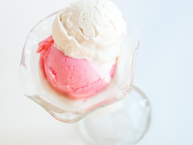 Scoop of delicious Italian fresh ice cream on white background.