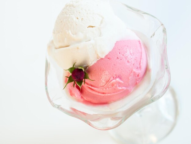 Scoop of delicious Italian fresh ice cream on white background.