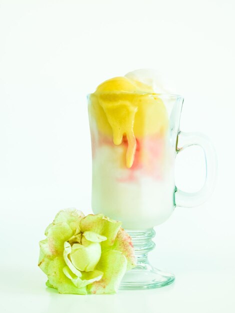 Scoop of delicious Italian fresh ice cream on white background.