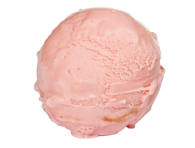 Scoop of strawberry ice cream from top on white background