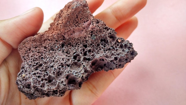 Photo scoria igneous rock, black and brownish red color from the central java volcano, indonesia.