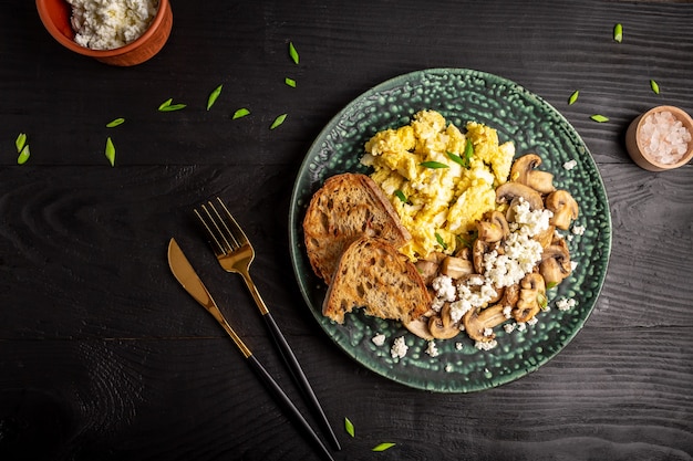 Scrambled eggs with champignon mushrooms.