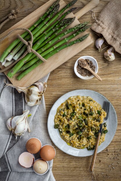 Scrambled eggs with mushrooms and garlic on wood