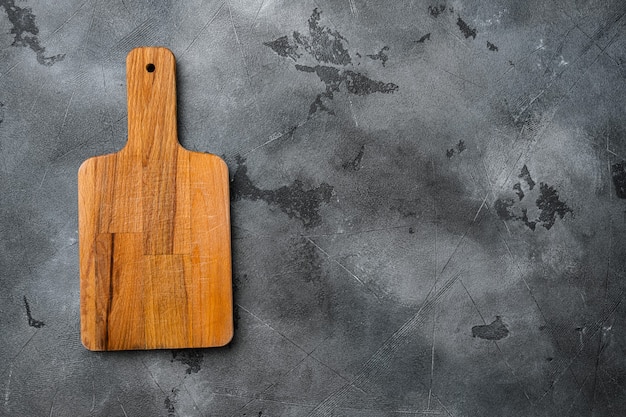 Scratched chopping board set, on gray stone table background, top view flat lay , with copy space for text or your product