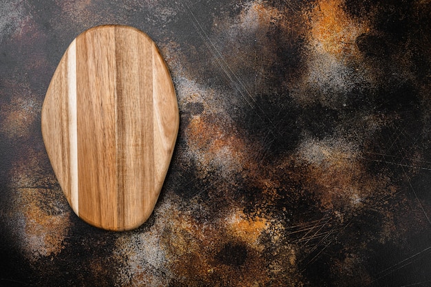 Scratched chopping board set, top view flat lay , with copy space for text or food, on old dark rustic table background