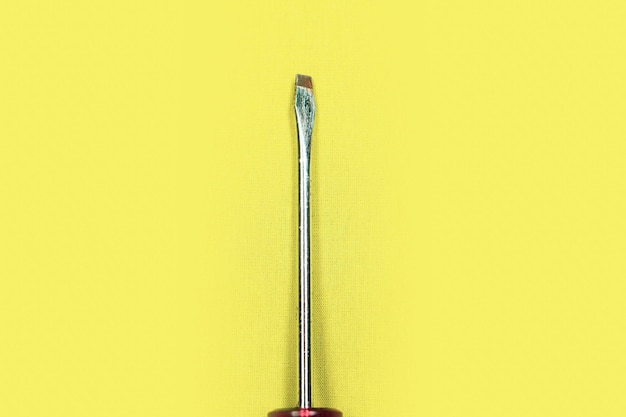 Screwdriver, metal tool, plastic handle,