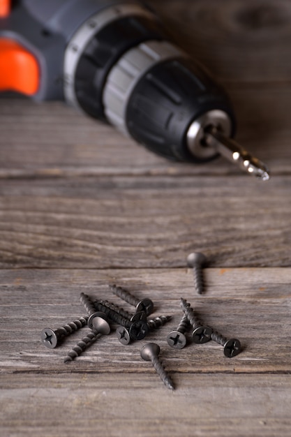 screwdriver on a wooden tablescrewed with screws