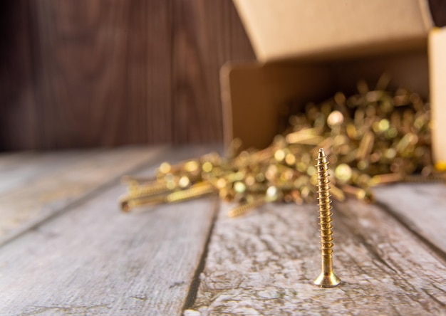 Screws box of screws photographed on rustic wood selective focus