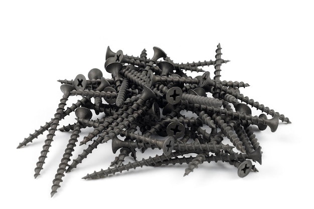 Screws on white black metal screws pile isolated on the white background