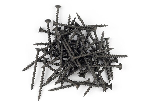 Screws on white Pile of black tapping screws isolated on a white background