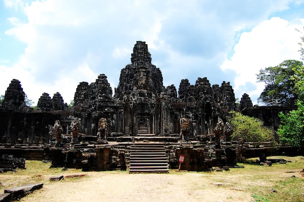 Sculpture carving ancient ruins antique building of Prasat Bayon Castle or Jayagiri Brahma Temple for Cambodian people and travelers travel visit respect pray at Angkor Thom Wat in Siem Reap Cambodia