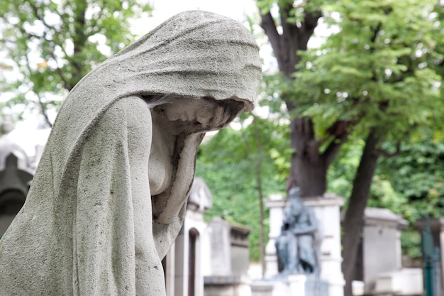 Sculpture crying at the cemetery