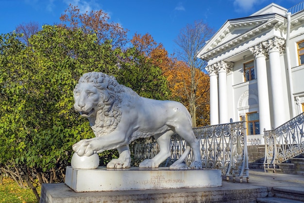 Sculpture of a lion holding a ball with its paw Elagin Palace Elagin Island SaintPetersburg