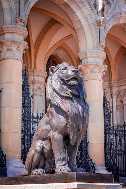 Sculpture of a lion near the Parliament building in Budapest.