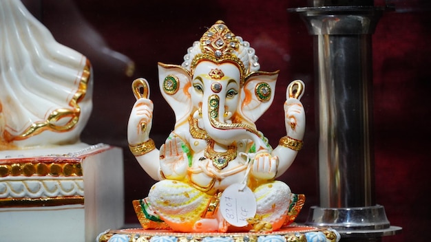 Sculpture of lord ganesha inside the glass jar