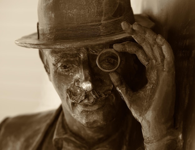 Sculpture of old professor with eyeglass background