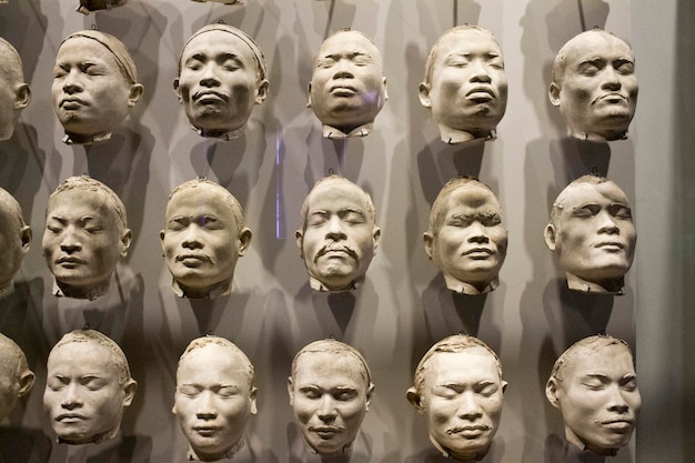 Photo sculptures of many heads in a contemporary art museum