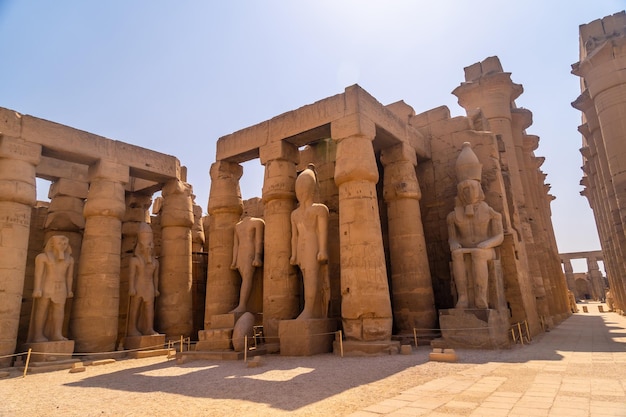 Sculptures of pharaohs and ancient Egyptian drawings on the columns of the Luxor Temple