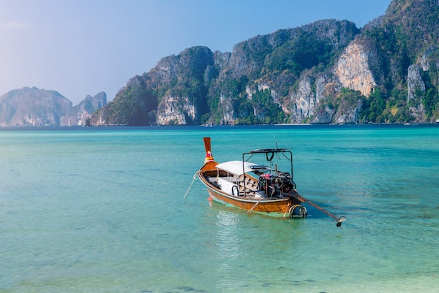 Sea beach atmosphere on Phi Phi Island, Krabi Province, very clear water, beautiful sea, white sandy beach, little tourists Between COVID-19 There are many taxi boats parked. Without tourists,