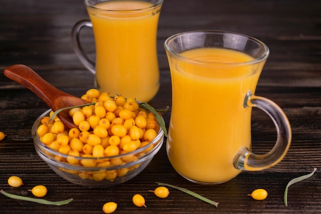 sea buckthorn tea on a black background.