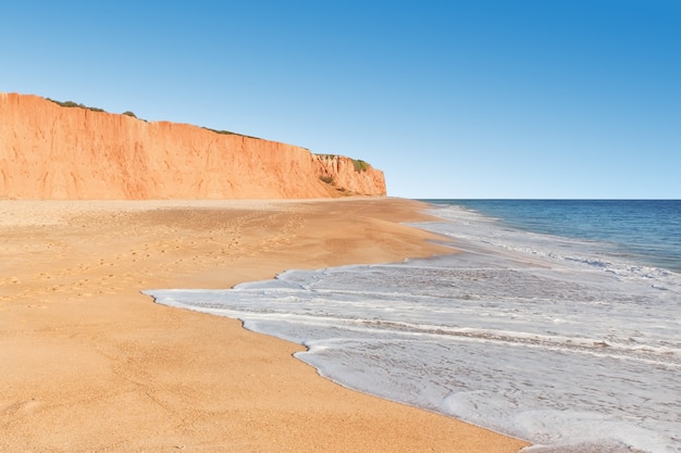 Sea Mountain sandy beach. On the coast of Portugal.