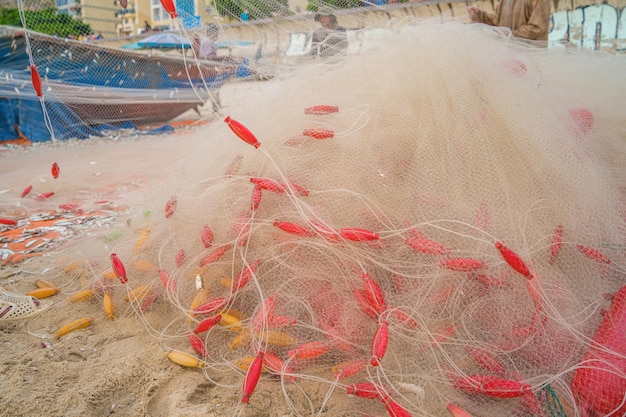 Sea nets fishing equipment or tackle as texture backdrop with natural sunlight and shadow Blue textured background of fishing nets closeup marine design for craft of fishermen