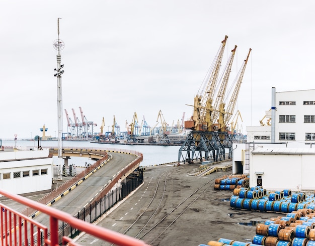 Sea port with cranes and docks early in the morning