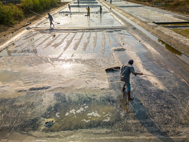 Sea salt process made from pile of salt in the salt pan by salt worker at rural area of Long Dien Ba Ria Vung Tau Salt fields is one of the most unique destinations in Viet Nam