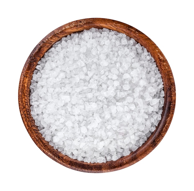 Sea salt in wooden bowl top view