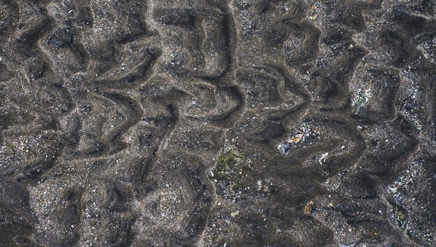 sea sand and small stones carried by the waves to the beach, great for your design material