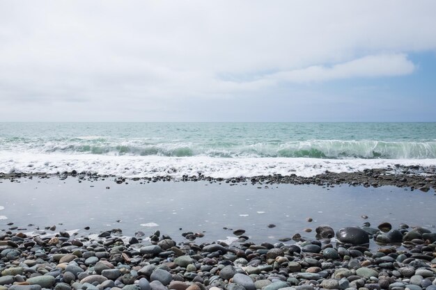 Sea stones background in the seaside on a beach