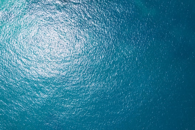 Sea surface aerial viewBird eye view photo of blue waves and water surface texture Blue sea background Beautiful nature Amazing view