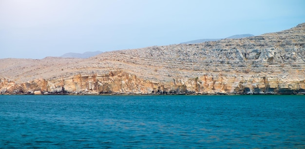 Sea tropical landscape with mountains and fjords Oman