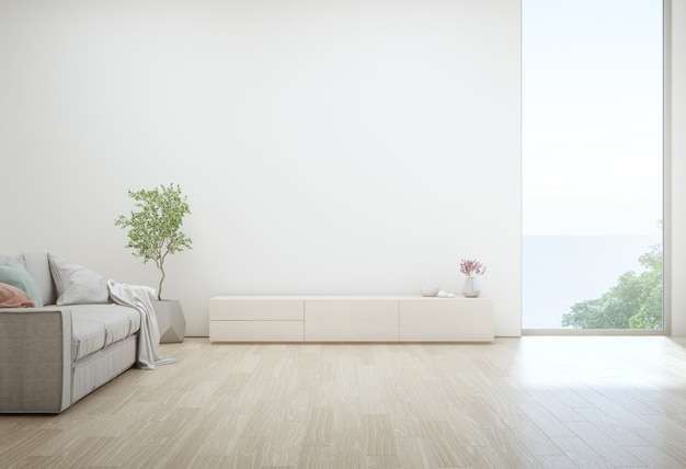 Sea view living room of luxury summer beach house with TV stand and wooden cabinet.