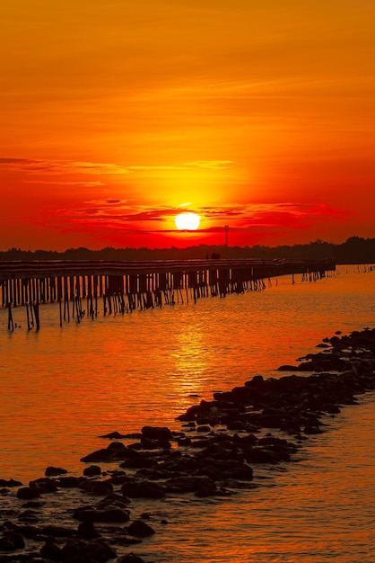 sea view and wooden bridge at sunrise,Wooden jetty on Carmol beach at sunrise, in Cartagena, Region