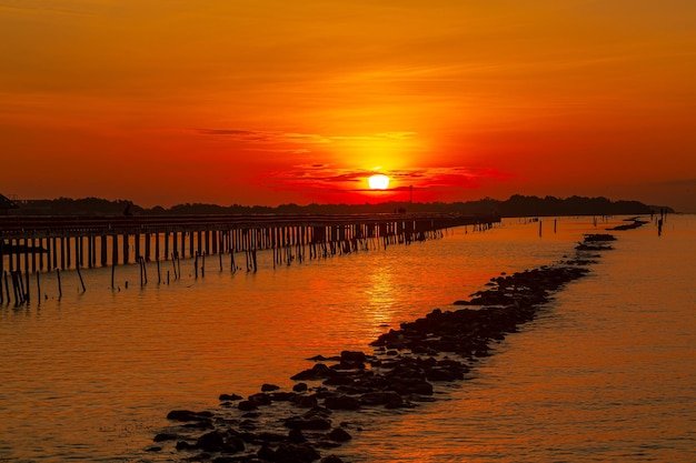 sea view and wooden bridge at sunrise,Wooden jetty on Carmol beach at sunrise, in Cartagena, Region