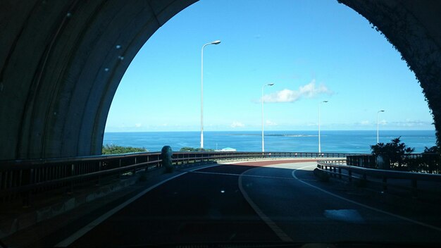 Sea viewed through road tunnel