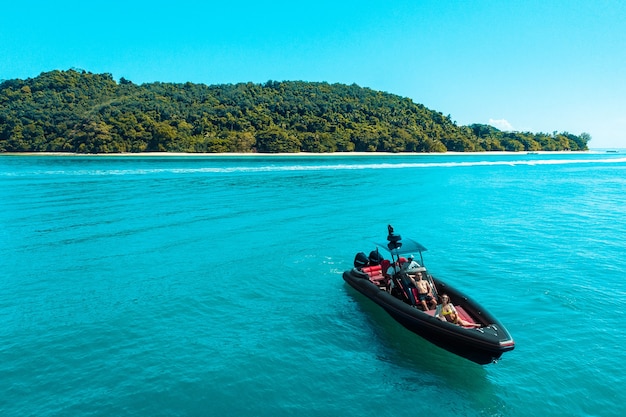 Sea voyage for a young couple on a motor boat